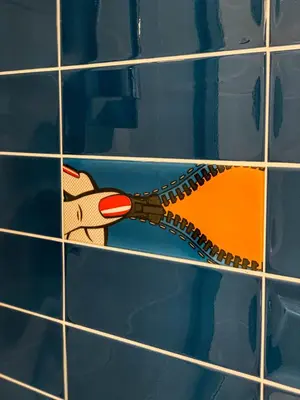 a painting of a dinosaur on a tile wall at Comfort Hotel Prague City in Prague