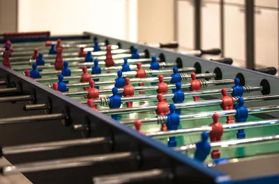 a row of billiard tables with blue and red balls at a&o Prague Rhea in Prague