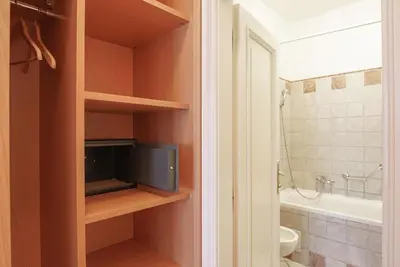 a bathroom with a tv and a bath tub at Hotel Tivoli Prague in Prague