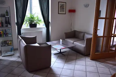 a living room with two chairs and a coffee table at Hotel Residence Select in Prague
