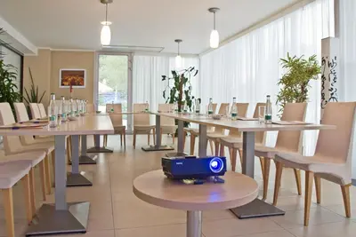 a large dining room with tables and chairs at Hotel Michael in Prague