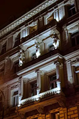 a building lit up at night at Boutique Hotel Seven Days in Prague