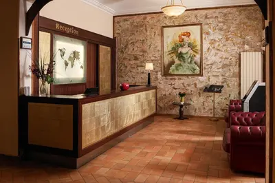 a waiting room with a reception desk in a building at Hotel Praga 1 in Prague