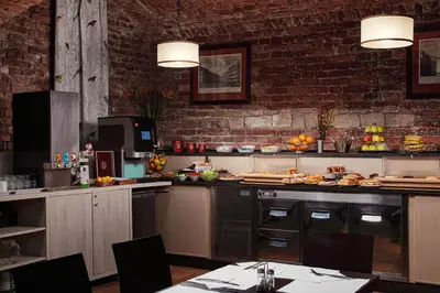 a kitchen with a counter with food on it at Hotel Praga 1 in Prague
