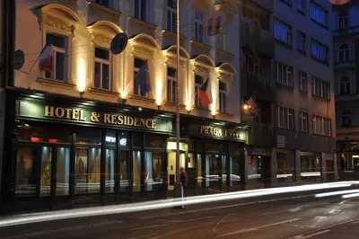 a building with a hotel andrescue signs on a street at Hotel Praga 1 in Prague