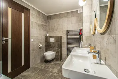 a bathroom with a sink and a toilet at Quite Loft with Balcony and 3 Air Conditioners in Prague