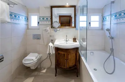 a bathroom with a sink and a toilet and a shower at Hotel Residence U Černého Orla in Prague