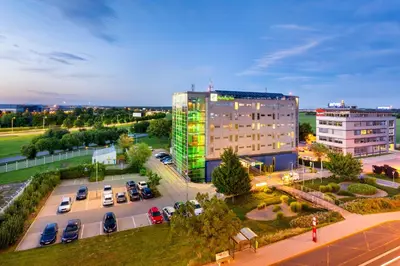 an overhead view of a parking lot with a building at Holiday Inn Prague Airport by IHG in Prague