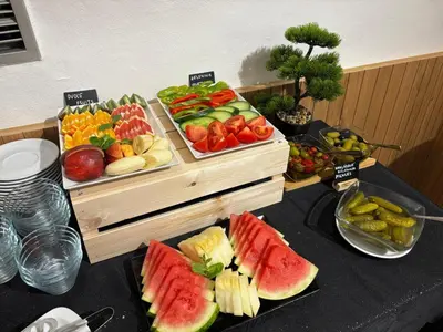 a buffet with fruits and vegetables on a table at The Golden Wheel Hotel in Prague