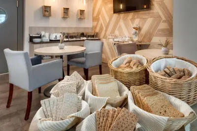 a room with baskets of bread and a table at Hotel Florenc in Prague