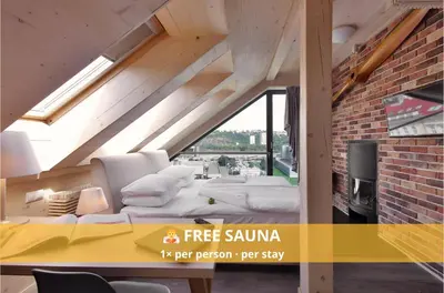 a flyer for a building with a room with a bed and chairs at Absolutum Wellness Hotel in Prague