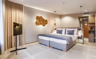 a bedroom with a bed and a tv in it at The President in Prague