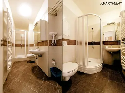 a bathroom with a toilet and a shower and sink at Hotel Otakar in Prague