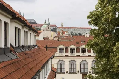 a large building with a lobby with a bar at Pytloun Old Armoury Hotel Prague, Stará Zbrojnice in Prague