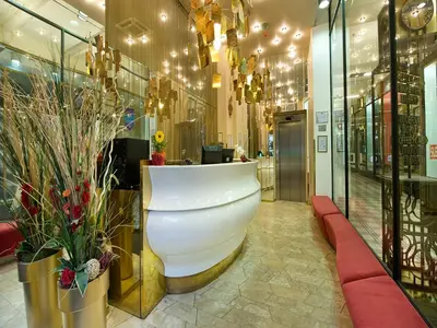 a store lobby with a white counter and flowers at EA Hotel Rokoko in Prague
