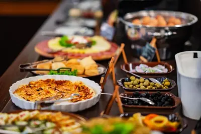 a table with many different types of food on it at Hotel U Divadla - Czech Leading Hotels in Prague