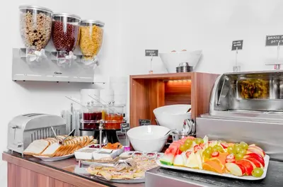 a kitchen with two plates of food on a counter at Boutique Hotel Green Lobster in Prague