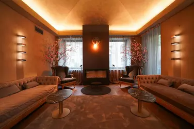 a large living room with couches and a fireplace at 987 Design Prague Hotel in Prague