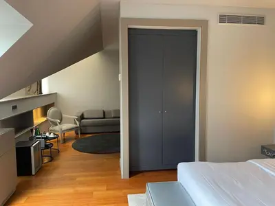 a bedroom with a door leading to a living room at 987 Design Prague Hotel in Prague