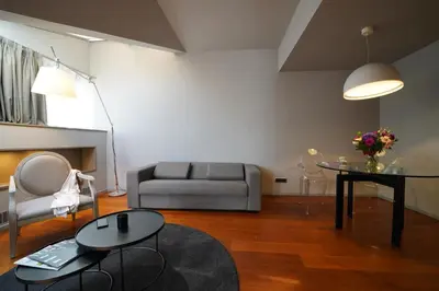 a living room with a couch and a table at 987 Design Prague Hotel in Prague