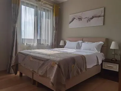a bedroom with a large bed and a window at yipin villa in Prague