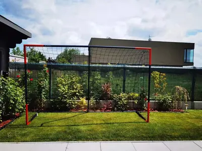 a soccer goal in the grass in front of a building at yipin villa in Prague