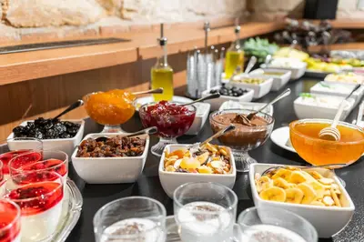 a buffet with many different types of food on a table at EA Hotel Victoria in Prague