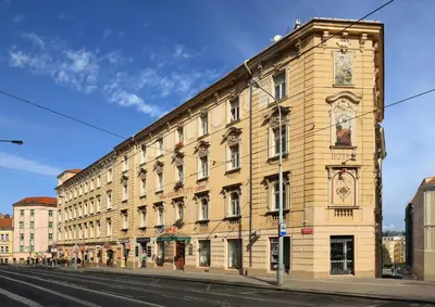 a large building on the side of a street at Hotel Golden City Garni in Prague