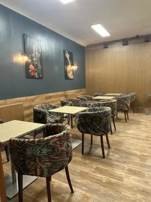 a dining room with tables and chairs and tables and chairs at Gallery Hotel SIS in Prague