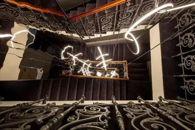 a room with a ceiling with lights on it at THE MANES Boutique Hotel Prague in Prague