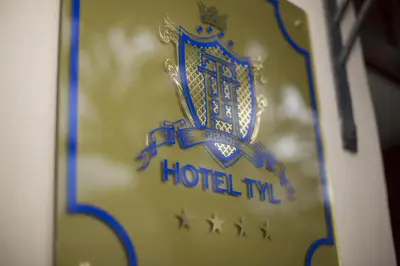 a sign on the door of a hotel inn at Hotel Tyl in Prague