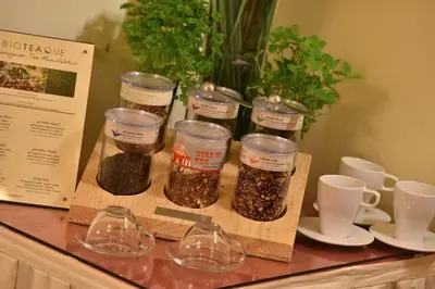 a counter with four jars of spices on a table at Hotel Angelis in Prague