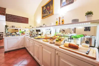 a buffet line with a lot of food at Hotel St George - Czech Leading Hotels in Prague