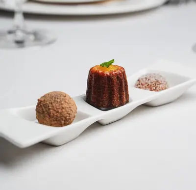 a plate of desserts on a table at Golden Well in Prague