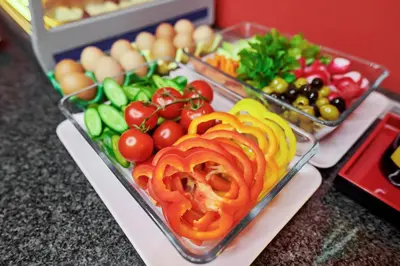 a tray of food with tomatoes and other vegetables at La Boutique in Prague