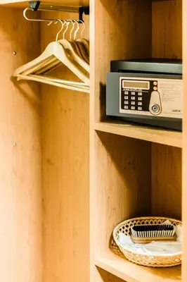 a closet with a radio on a wooden shelf at Archibald City in Prague