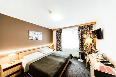 a hotel room with a bed and a desk at Archibald City in Prague