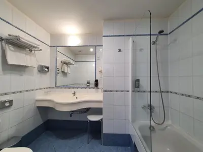 a bathroom with a sink and a shower and a toilet at Máchova in Prague