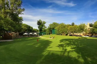 a large building with a tent in a grass field at Chateau St. Havel - Wellness Hotel in Prague