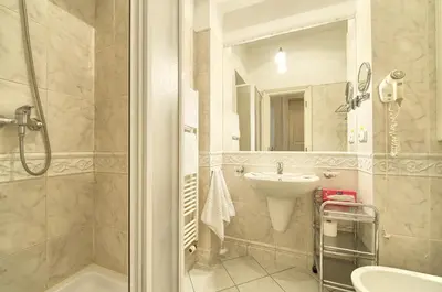 a bathroom with a shower and a sink at Residence Masna in Prague