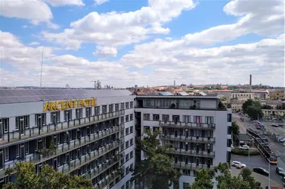 a building with a amazon sign on the top of it at Akcent hotel in Prague