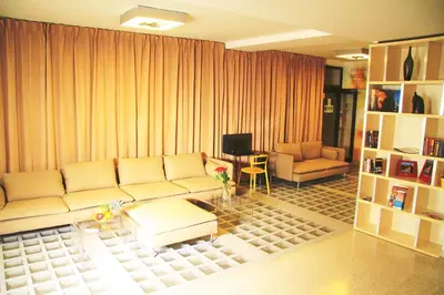 a living room with a couch and a table at Akcent hotel in Prague