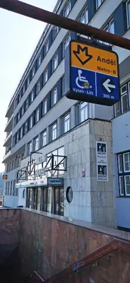 a building with a street sign in front of it at Akcent hotel in Prague
