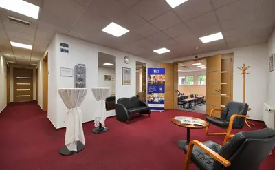 a waiting room with chairs and a hair salon at EA Hotel Populus in Prague