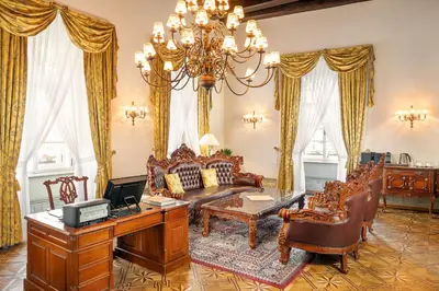 a living room with a couch and a table at Hotel U Prince Prague by BHG in Prague