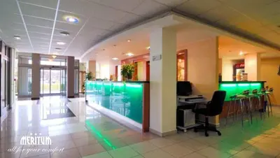 an office with a pool in the middle of a building at Hotel Meritum in Prague