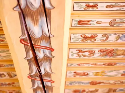 a stairwell withpainted wood floors and patterns on it at Hotel U Zlatého Stromu Prague by BHG in Prague