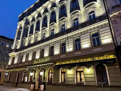 a building with lights on the side of it at Green Garden Hotel in Prague