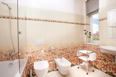 a bathroom with a toilet and a sink at Green Garden Hotel in Prague