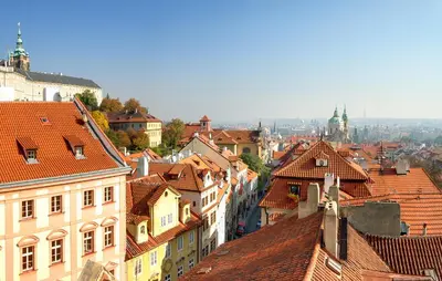 a view of a city with roofs and buildings at Red Lion Hotel in Prague